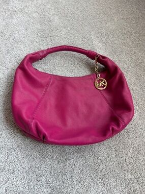 Michael Kors Fuchsia Pebbled Leather Hobo with Gold MK Charm
